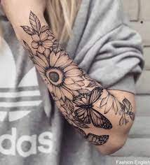 The detailing in this tattoo is remarkable and is perfect for your forearm or back. Celebrate The Beauty Of Nature With This Inspiring Sunflower Tattoo Beauty Celebr Sunflower Tattoo Sleeve Sleeve Tattoos For Women Forearm Tattoo Women