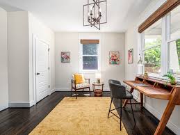 This Old North Durham Dacian delight was custom crafted by Gail Crabtree in  2017. The home boasts 4 bedrooms and an open-concept main floor. The modern  kitchen, cozy living room with fireplace