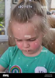 Toddler playing with dolly Stock Photo