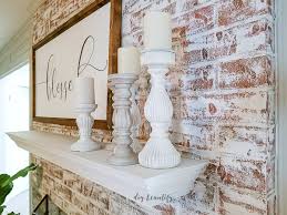 Frog tape, craft paper, disposable plastic once the brick was covered, we cut a section from the plastic drop cloth and wrapped the mantle in it. How To Update A Brick Fireplace With Chalk Paint Diy Beautify Creating Beauty At Home