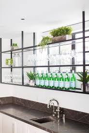 Chic Basement Bar Features Black Metal Shelves Fixed In Front Of A Window And Above White Shaker Black Metal Shelf Glass Bar Shelves Small Stainless Steel Sink