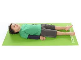 Corpse Pose Kids Yoga Poses Yoga For Classrooms Namaste Kid Yoga For Kids Kids Yoga Poses Yoga Poses