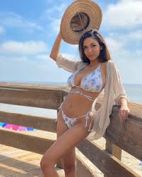 Tara Yazdi Is An Busty Brunette Displaying Her Curves In Various Bikinis