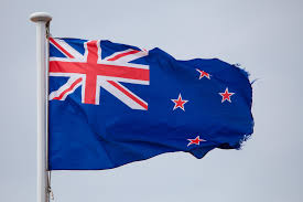 The australian flag, bottom, and the new zealand flag, with its distinctive red stars, fly on the sydney harbour bridge in 2005. Pacific News Minute Anzac Alliance Strained In War Of Words Between Australia And New Zealand Hawaii Public Radio