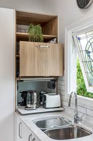 A kitchenette is a smaller area than a kitchen for a small refrigerator, a microwave oven, hotplate, and/or a sink often found in motel and hotel rooms, small apartments, college dormitories or office buildings. Kitchenettes What Are They And Do You Need One Houzz Nz