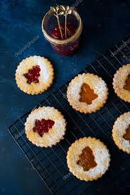 · red raspberry preserves or jam . Traditional Austrian Linzer Cookies With Jam Homemade Cakes Selective Focus 442167824 Larastock