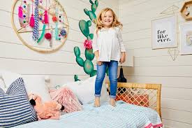 Soft, pastel wall colors paired with a brighter floral bedspread. 16 Bohemian Kids Rooms Boho Decor Ideas Hgtv