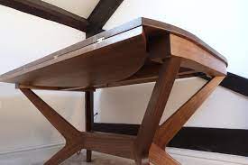 The table is very functional due to its expandability. Walnut Extending Dining Table Irene Banham Furniture