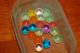 On the same pumpkin, cut off the bottom so it lies flat on the table and then cut blocks or arches from the bottom where marbles can escape when they drop from the top. Silly Little Bouncy Balls And A Geocaching Surprise