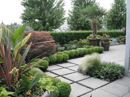 Solar Landscape Lights Landscape Tropical With Boxwood Canna City Garden Container Design Garden G Tropical Landscaping Tropical Garden Design Landscape Design