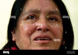 Tears fall from the eyes of Maria Chavalan-Sut of Guatemala as she speaks  during an interview at Wesley Memorial United Methodist Church in  Charlottesville, Va.,