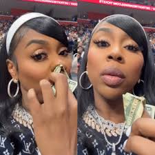 Kash Doll receives backlash for wiping her nose with a $20 bill at a NBA  game