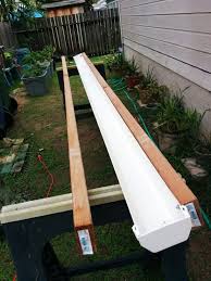 Beginnings Of A Self Watering Rain Gutter Grow System Per Larry Hall Brainerd Mn Gutter Garden Backyard Farming Rain Gutters