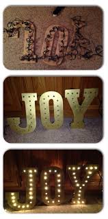 The scene is cut onto the o of joy with the details engraved and painted black. Make This Beautiful Light Up Joy Sign In Just A Few Minutes Sign Joy Christmas Diy Christmas Joy Christmas Time Outdoor Christmas Lights
