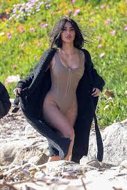 Kim Kardashian writhes around in nude swimsuit during racy beach photo  shoot | Daily Mail Online