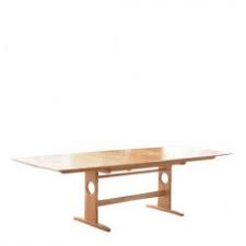 This set includes four wooden side chairs and a dining table with an extension leaf. High Quality Extending Dining Tables Hunter Furnishing