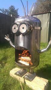 I found this craft on google when i was googling door. 9 Jaw Dropping Lawn Decorations For The Yard That Has Everything Minion Fire Pit Metal Fire Pit Fire Pit Designs