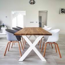 A modern simplistic dining room table design with pine slabs and flat bar legs bent in a triangular shape. Hairpin Legs Live Edge Oak Industrial Dining Table By Strachel A F S Alternative Furniture