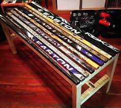 Chapeau trick sticks hockey article of furniture creates custom hockey piece diy hockey stick bench of furniture from new victimized and broken hockey sticks and equipment. Hockey Stick Bench So Cool Hockey Stick Furniture Hockey Room Hockey Decor