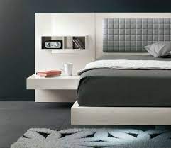 The curved metal frame is reminiscent of a modern industrial style, while the details in the headboard and footboard bring a touch of vintage design. Cool Floating Futuristic Bed Modern Headboard Design Modern Bed Futuristic Bed Bed Design