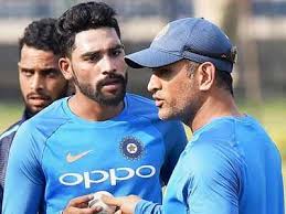India's mohammed siraj, centre, is congratulated by teammates after taking his fifth wicket against australia on day 4 of the fourth test at the gabba on monday, january 18. India Vs West Indies How Ms Dhoni S Pep Talk Helped Mohammed Siraj Earn Maiden Test Call Up