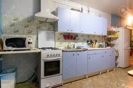 With a damp, soapy cloth, wipe down the exterior. Outdated Kitchen Interior With A Hundred Finishes And A Simple Kitchen Set Stock Photo Picture And Royalty Free Image Image 148006285