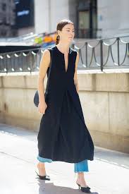 Proof That A Black Dress Doesn T Have To Be Boring Dress Over Jeans Fashion Dress Over Pants