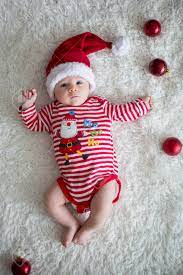 Christmas Portrait Of Cute Little Newborn Baby Boy Dressed In Christmas Clothes And Wearing Santa Hat Studio Shot Winter Time Stock Photo Picture And Royalty Free Image Image 90113098