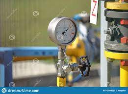 Pressure Gauge For Measuring The Pressure Of Natural Gas In A Gas Pipeline Yellow Transport Pipes On The Surface Of The Fence Stock Image Image Of Control Equipment 142888227