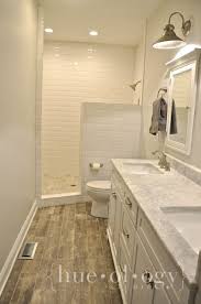 Metro Wall Tiles Interlocking Vinyl Wood Flooring And Carrara Marble Vanity Surface All Available At Solid House Bathroom Master Bathroom Bathroom Flooring
