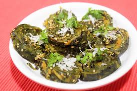 Patra is a traditional gujarati vegetarian dish prepared with nutritious colocasia leaves which are stuffed with a mix of ingredients such as garam masala, gram flour, mustard seeds, sesame seeds, turmeric, chili paste, and asafetida. Gujarati Patra Recipe Gujarati Farsan Gujarati Rasoi