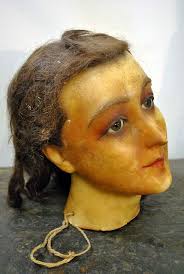 1900 wax head mannequin. Would have scared me to hide under the sheets when  i was a kids but now i like it;)