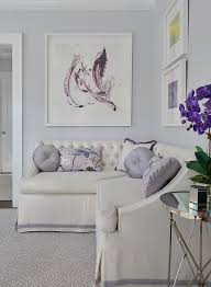 It's neutral which makes for a sound wall color choice because it works with many other colors that you might incorporate such as blue, orange, yellow, white, black, etc. White Leather Sectional With Purple Trim Transitional Living Room