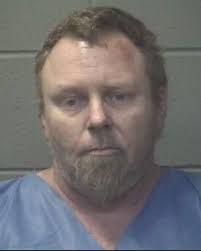 Standoff ends with fugitive taken into custody