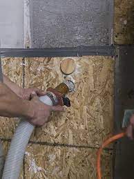 Dense packing walls with cellulose from the interior. Cima Cellulose Insulation Manufacturers Association