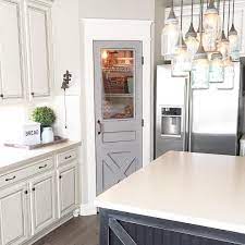In that section up top you can cut it, leave it open, screen it with chicken wire (like megan did @txsizedhome), fill it with glass or leave it alone. Pantry Door Makeover Ourfauxfarmhouse Farmhouse Kitchen Mason Jar Lighting Farmhouse Kitchen Decor Farmhouse Pantry Kitchen Pantry Doors