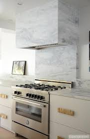 Marble worktop styles are back on trend for the luxury look and feel. White Kitchen Cabinets Grey Marble Countertops Design Ideas