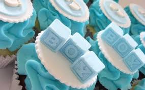 So with our darker blue with this large star tip we're going to pipe starting from the center cover a little over the cupcake and go. 1001 Ideas For Baby Shower Cakes For Boys And Girls