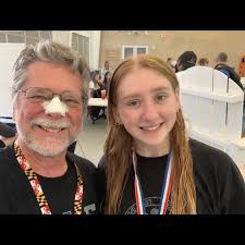 ICING ON THE CAKE: After the District 5A Diving Meet today in Round Rock,  junior Iris Burns-Traganovsky (left) poses for photos with two LASA diver  friends, Elizabeth Bircher (center) and Frogby Sachs (