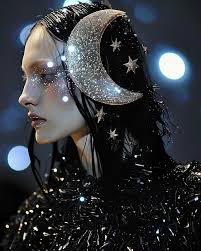 A moon child born of celestial tides, With stars as her crown, a lunar  ballet.