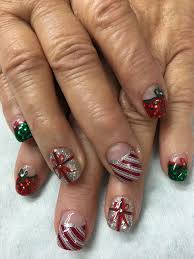 Christmas Nails Chunky Glitter Christmas Presents Bows Candy Cane Gel Nails Gel Nail Designs Holiday Nail Art Winter Nails