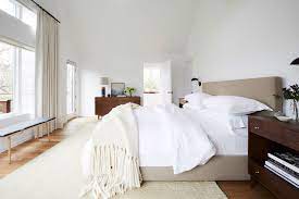 The bed itself is short covered in a gray sheet with white pillows. 20 Cozy Bedroom Ideas How To Make Your Bedroom Feel Cozy