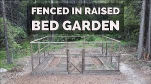 How to use a roll of orange plastic ribbon like marking tape to shore up a hole in the top of a deer fence designed to keep deer out of the garden complete with picture of said experimental. Diy Fenced Raised Bed Garden Keep Deer Out Youtube