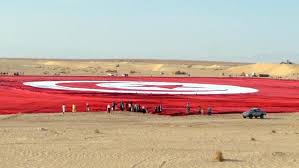 The red color on the flag also symbolizes islam, which is the predominant religion in tunisia. Tunisians Unfurl World S Largest Flag Al Arabiya English