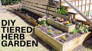 The first step of the project is to clear the area where you'll be building your tiered wall. Diy Tiered Herb Garden Youtube