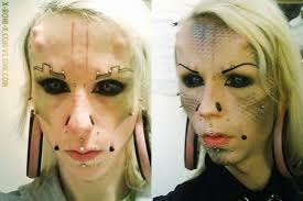 Black sclera tattoos like the beautiful Miss Roni Lachowicz here.