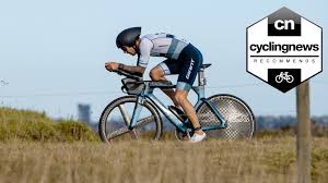 / trɑɪˈæθ·lɑn / a race in which the competitors swim, ride a bicycle, and run without stopping between events: Best Triathlon Wheels Top Time Trial Wheels For When You Re Up Against The Clock Cyclingnews