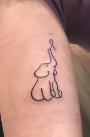 25 Meaningful Ribbon Tattoo Designs For Beautiful Women Blurmark Ribbon Tattoos Tattoos Cancer Ribbon Tattoos