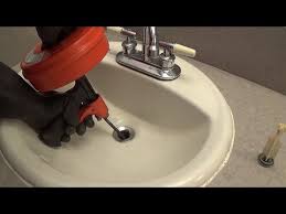 to unclog a bathroom sink with a snake