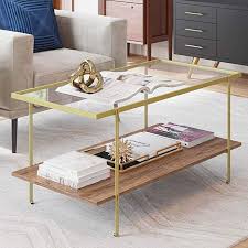The table design is simple yet sophisticated. Amazon Com Nathan James 31201 Asher Mid Century Rectangle Coffee Table Glass Top And Rusti Gold Coffee Table Coffee Table With Storage Coffee Table With Shelf